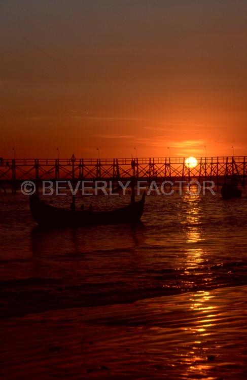 (Multiple values);sun;water;colorful;sillouettes;reflections;bridge;indonesia
